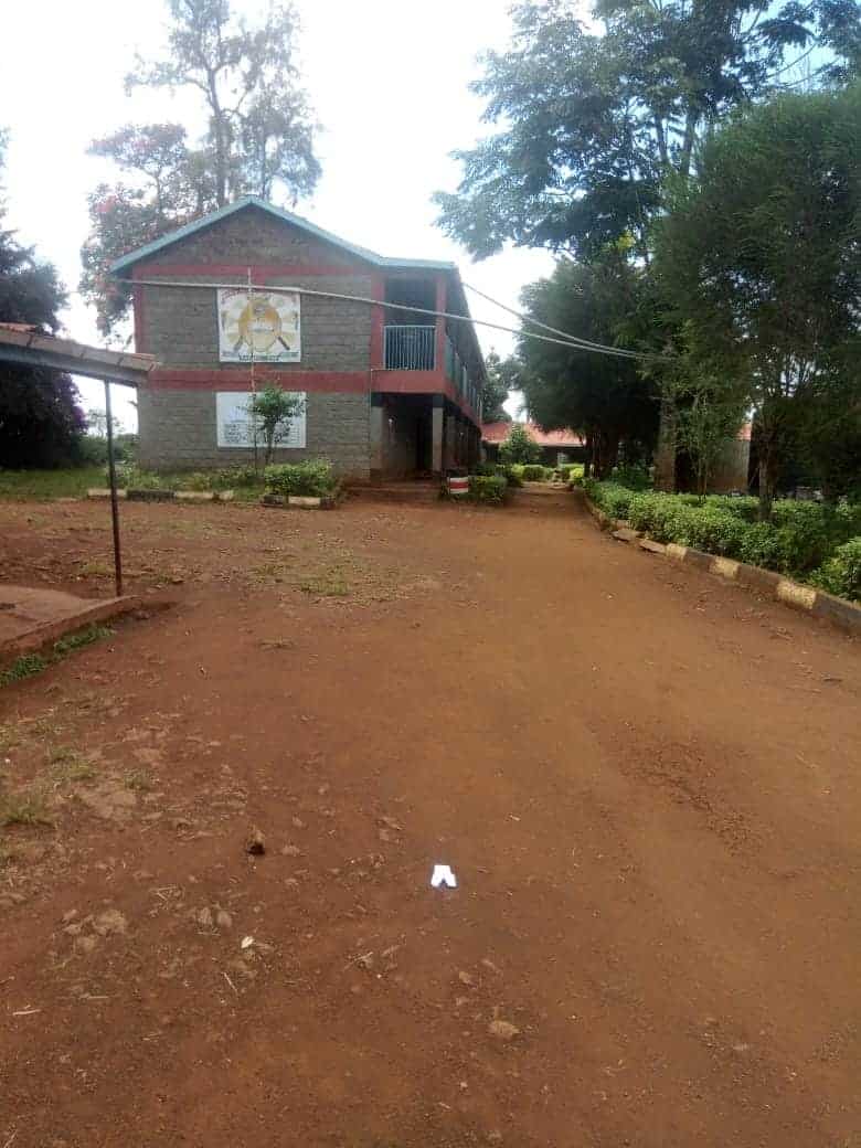 Inside the compound of Njenga Karume Primary school and a one storey building in the vicinity which houses part of the school's classrooms